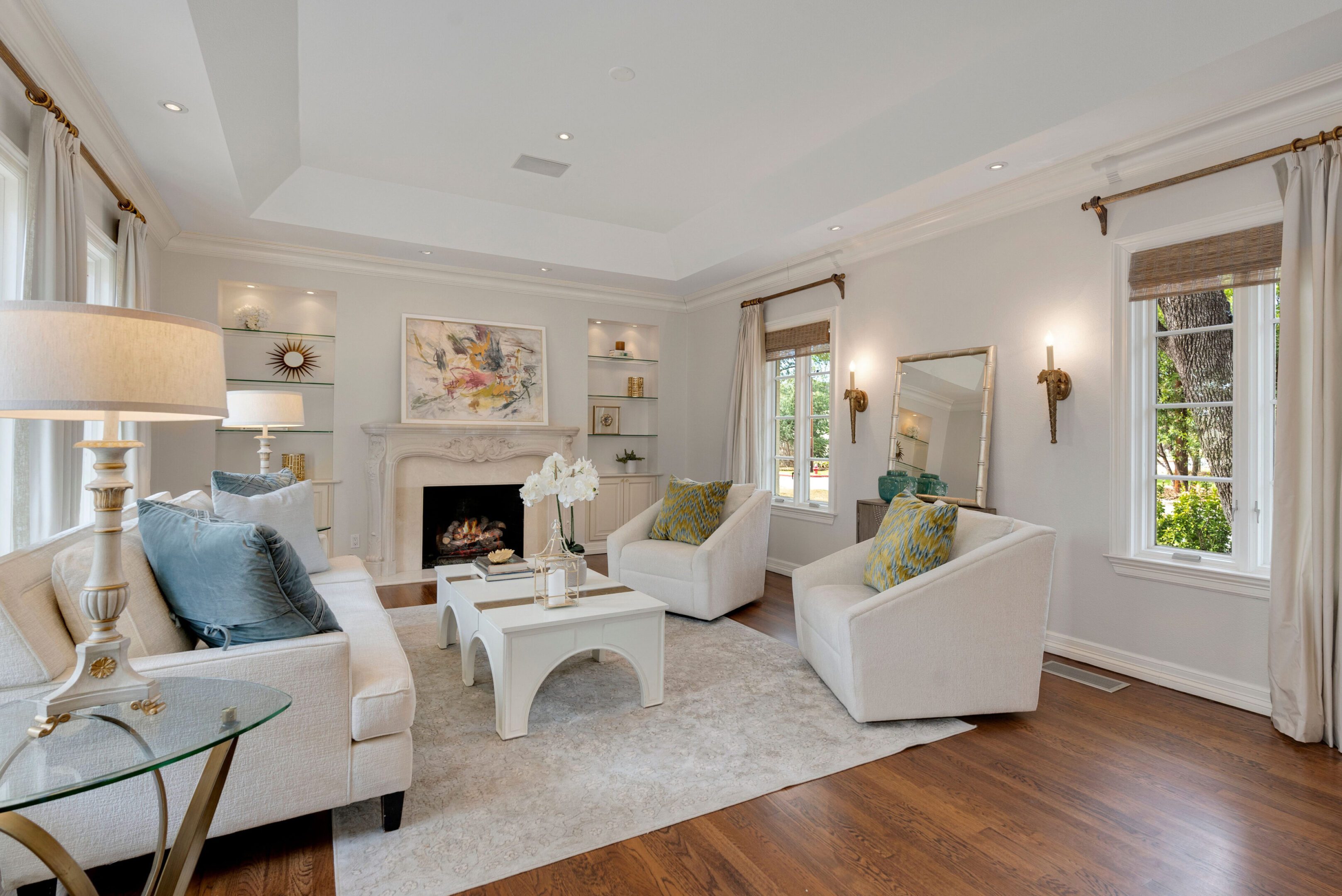 Formal living room with fireplace inside a luxury Alamo Heights home marketed by Realtor Kerri Hoermann.